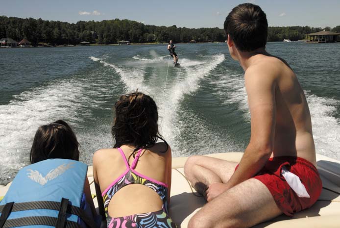 Watching wakeboarding from back of boat